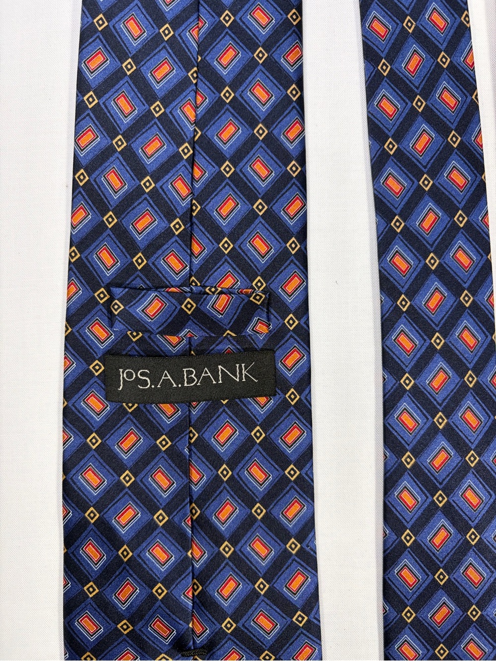 Jos. A. Bank Blue Diamond-Pattern Silk Tie with Red and Gold Accents
